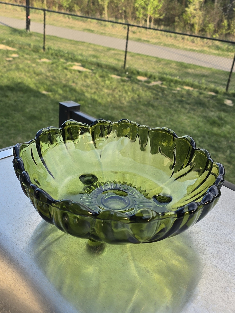 vintage green Indiana 1970s Glass Sunflower footed bowl with a ruffled edge